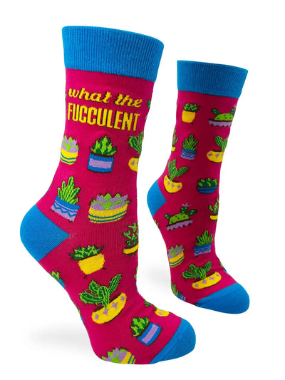 Bright pink women's crew socks with blue cuffs, heels, and toes, featuring colorful potted succulent plants and bold yellow text "What the Fucculent"