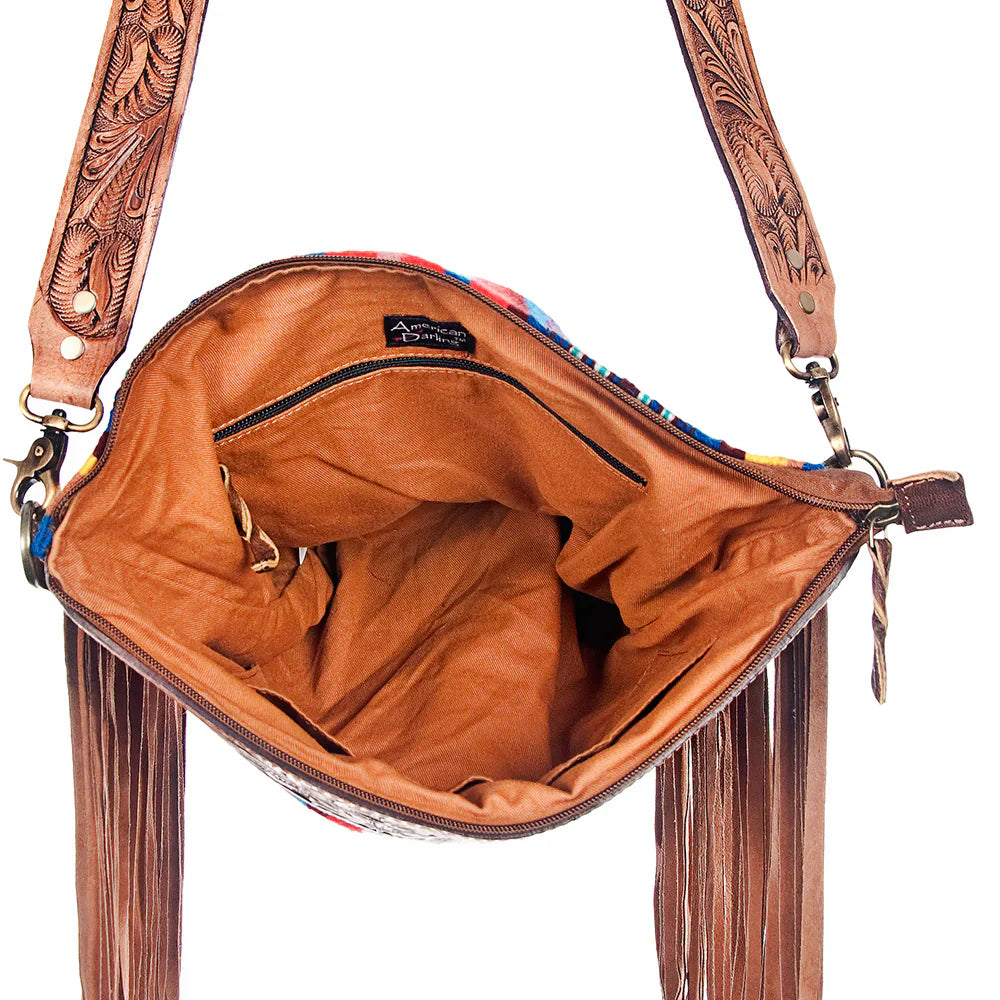 Interior view of American Darling Large Crossbody Messenger Bag ADBG400 with hand-tooled leather strap and fringes, open zipper showing spacious tan leather-lined compartment