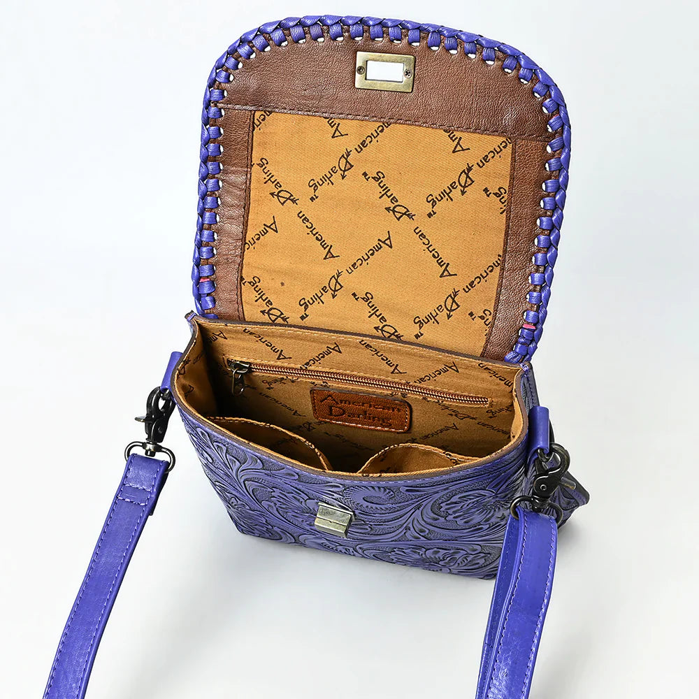 American Darling Small Crossbody Bag in purple hand-tooled leather with adjustable strap and detailed braiding, open view showing interior compartments and branded lining