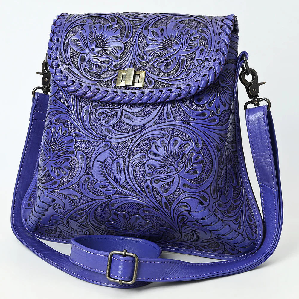 American Darling Small Crossbody Bag in purple vegetable tanned full grain leather with detailed hand-tooled floral design and adjustable strap