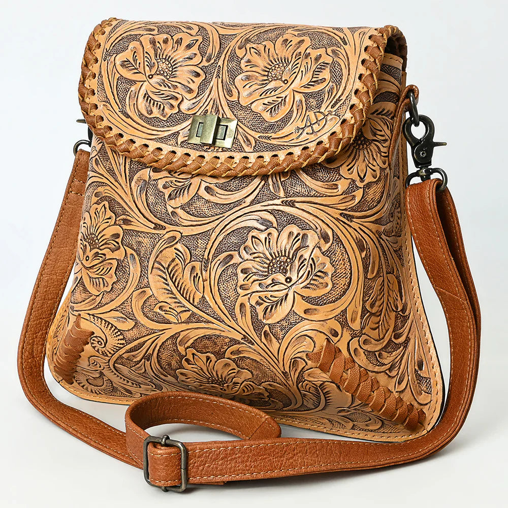 American Darling Small Crossbody Bag in vegetable tanned full grain leather with detailed hand-tooled floral design, braided edges, adjustable strap, and antique finish metal fittings.
