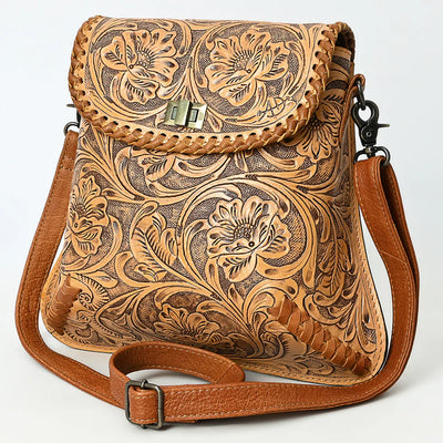 American Darling Small Crossbody Bag in vegetable tanned full grain leather with detailed hand-tooled floral design, braided edges, adjustable strap, and antique finish metal fittings.