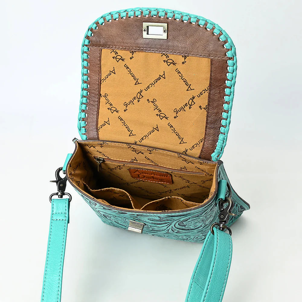 American Darling Small Crossbody Bag in turquoise embossed genuine leather with adjustable strap and antique metal fittings, open view showing branded interior lining and compartments