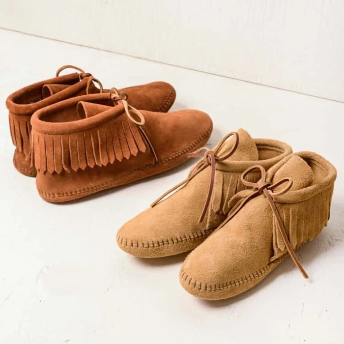 IN SHOP Minnetonka Classic Fringe Boot for women in soft suede with fringe detailing and rawhide lace, available with hardsole or softsole options
