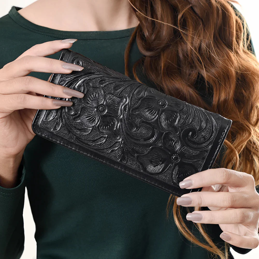 Black American Darling Wallet ADBG1269A with hand-tooled floral design in genuine full grain leather held by woman