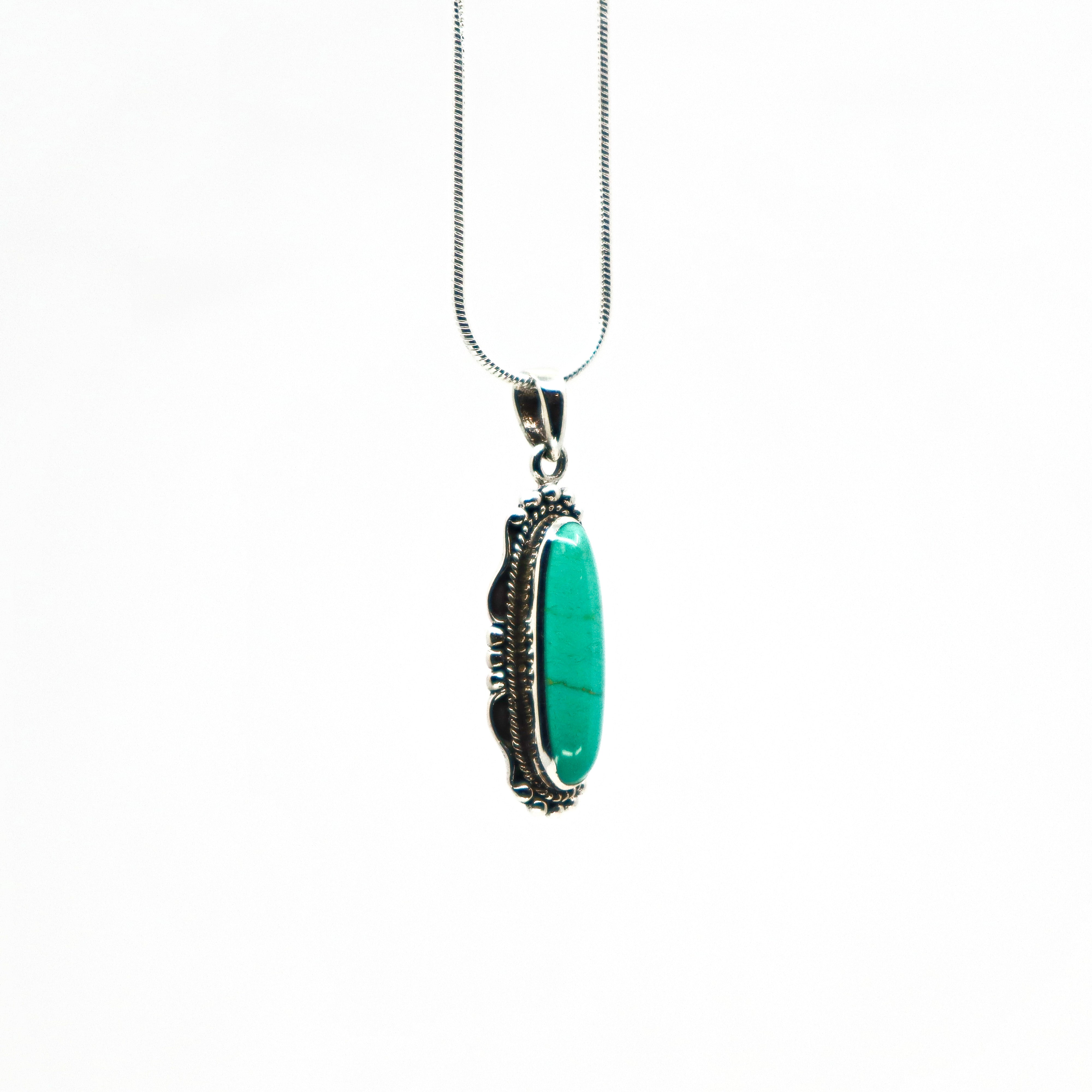 Sterling silver turquoise necklace with an elongated oval turquoise pendant on a delicate silver chain