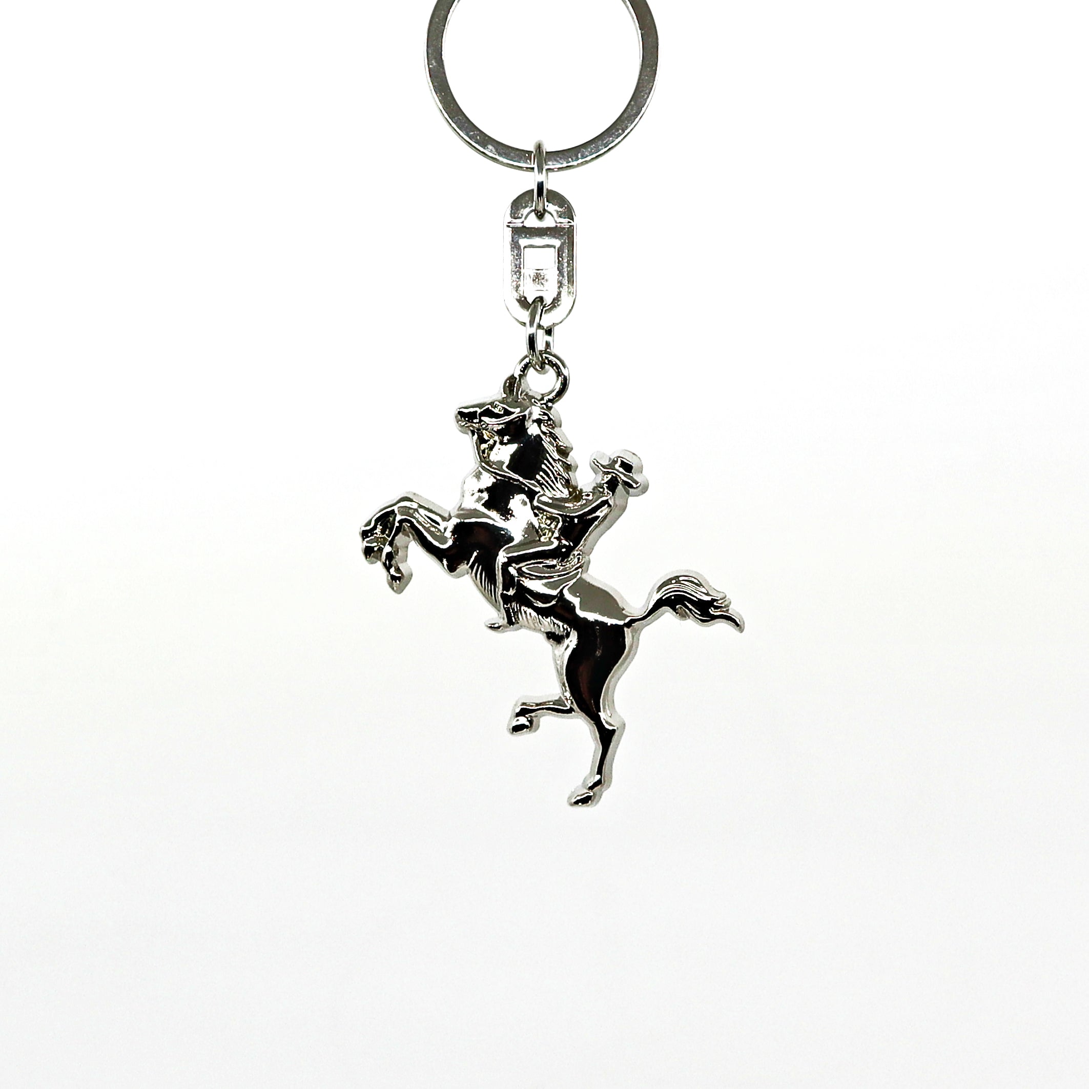 Silver metal Bucking Bronco key ring with a detailed horse and rider design