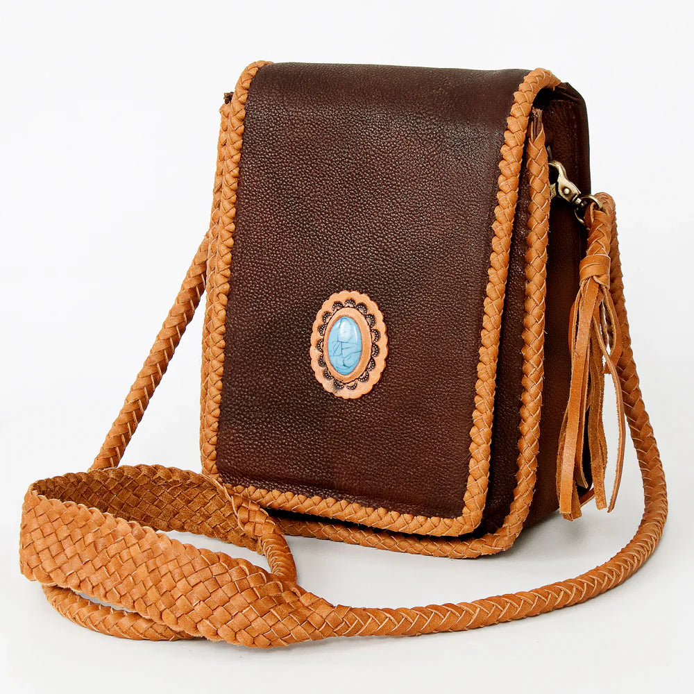 American Darling small crossbody bag with brown leather, fringes, turquoise stone, and braided details.
