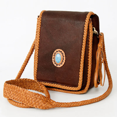 American Darling small crossbody bag with brown leather, fringes, turquoise stone, and braided details.