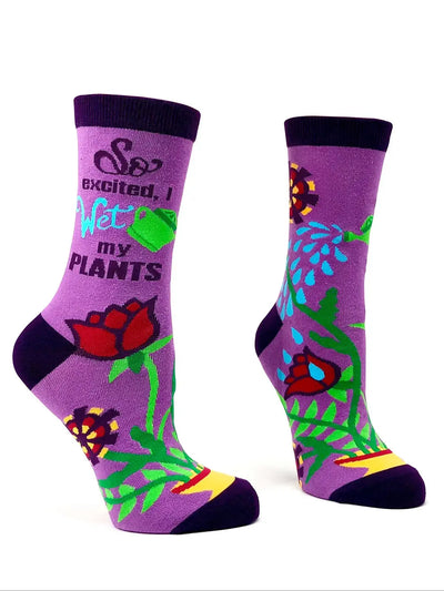 Purple women's crew socks with "So Excited, I Wet My Plants" phrase and colorful garden-themed design