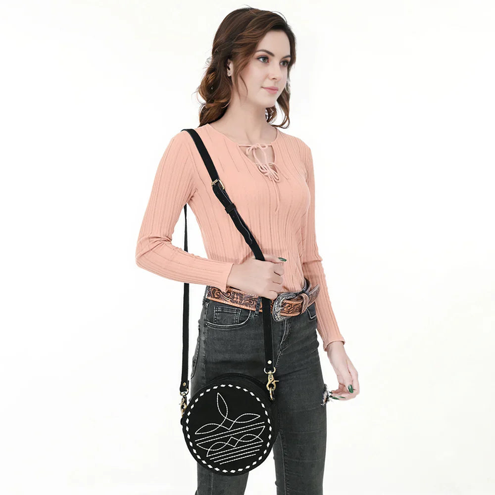 American Darling Canteen Bag made of genuine suede leather with adjustable strap worn by a person.