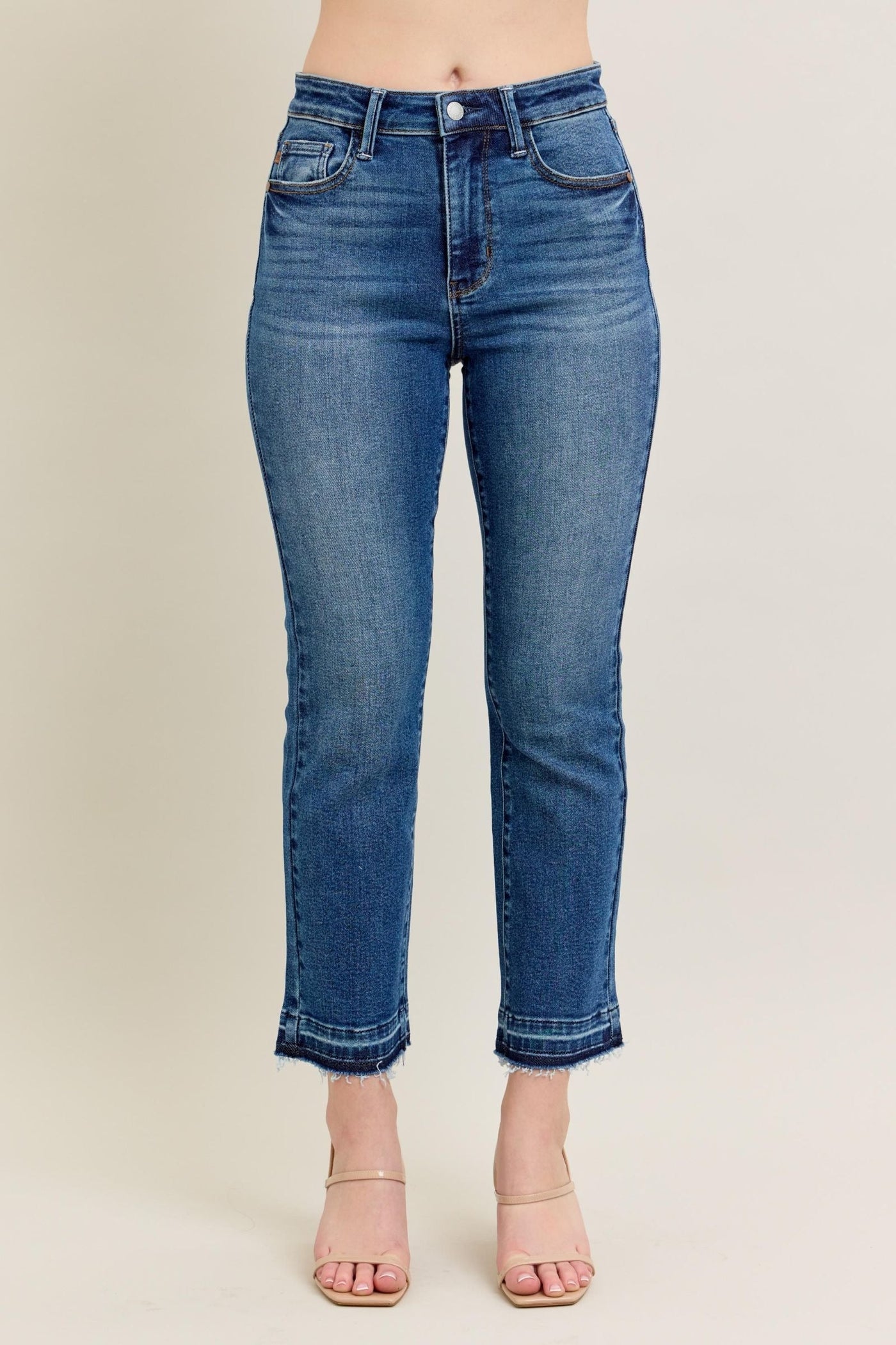 High-rise Judy Blue Jeans 88981 with vintage wash, raw hem, and kick flare silhouette.