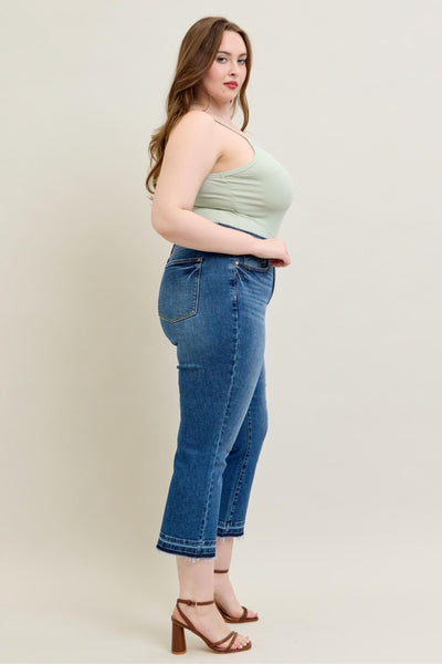 High-rise Judy Blue Jeans with kick flare and raw hem in vintage wash.