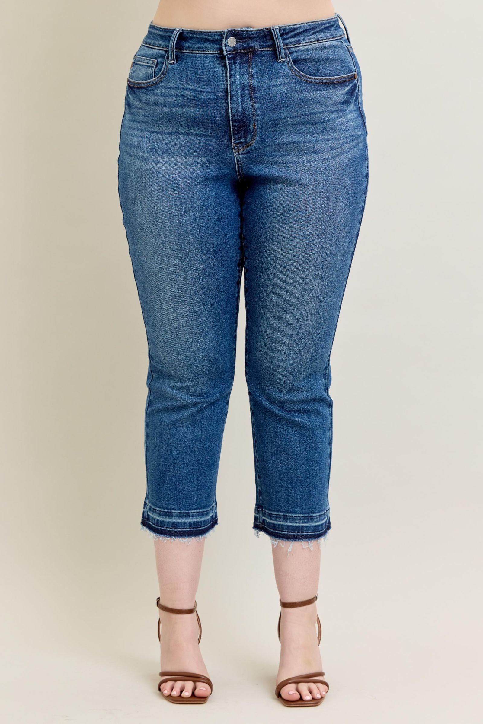 High-rise vintage wash Judy Blue Jeans with kick flare and raw hem.