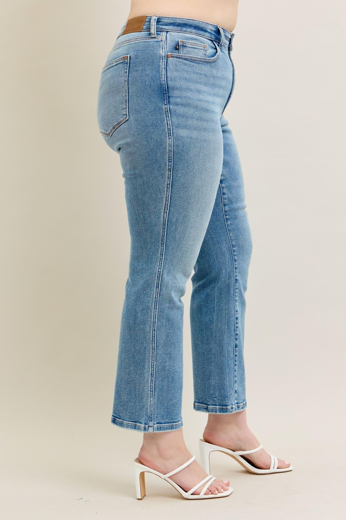 High waist vintage straight jeans in light wash with clean styling.
