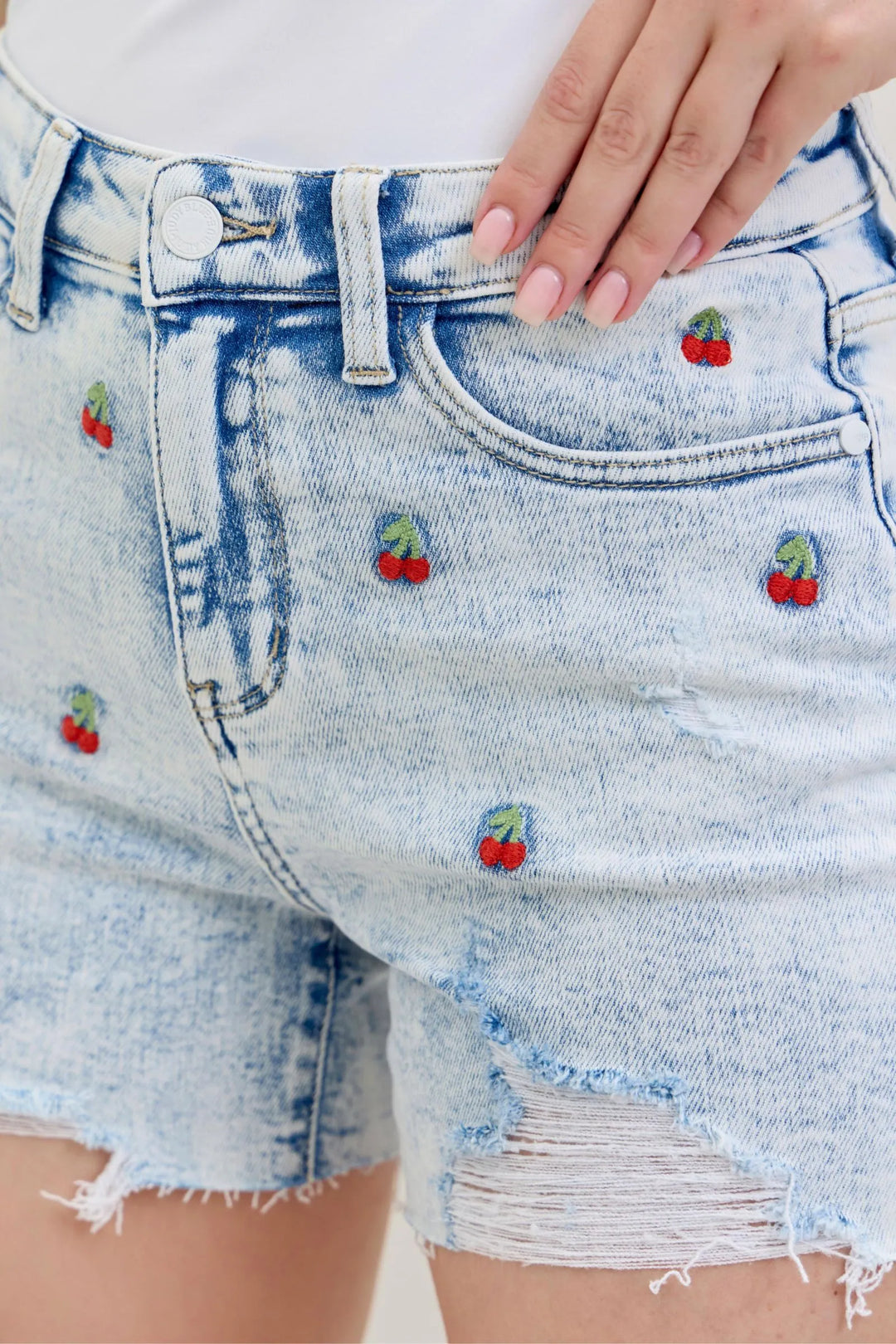 Judy Blue Shorts 150125 with high-rise waist, acid wash, cherry embroidery, and 4" inseam.