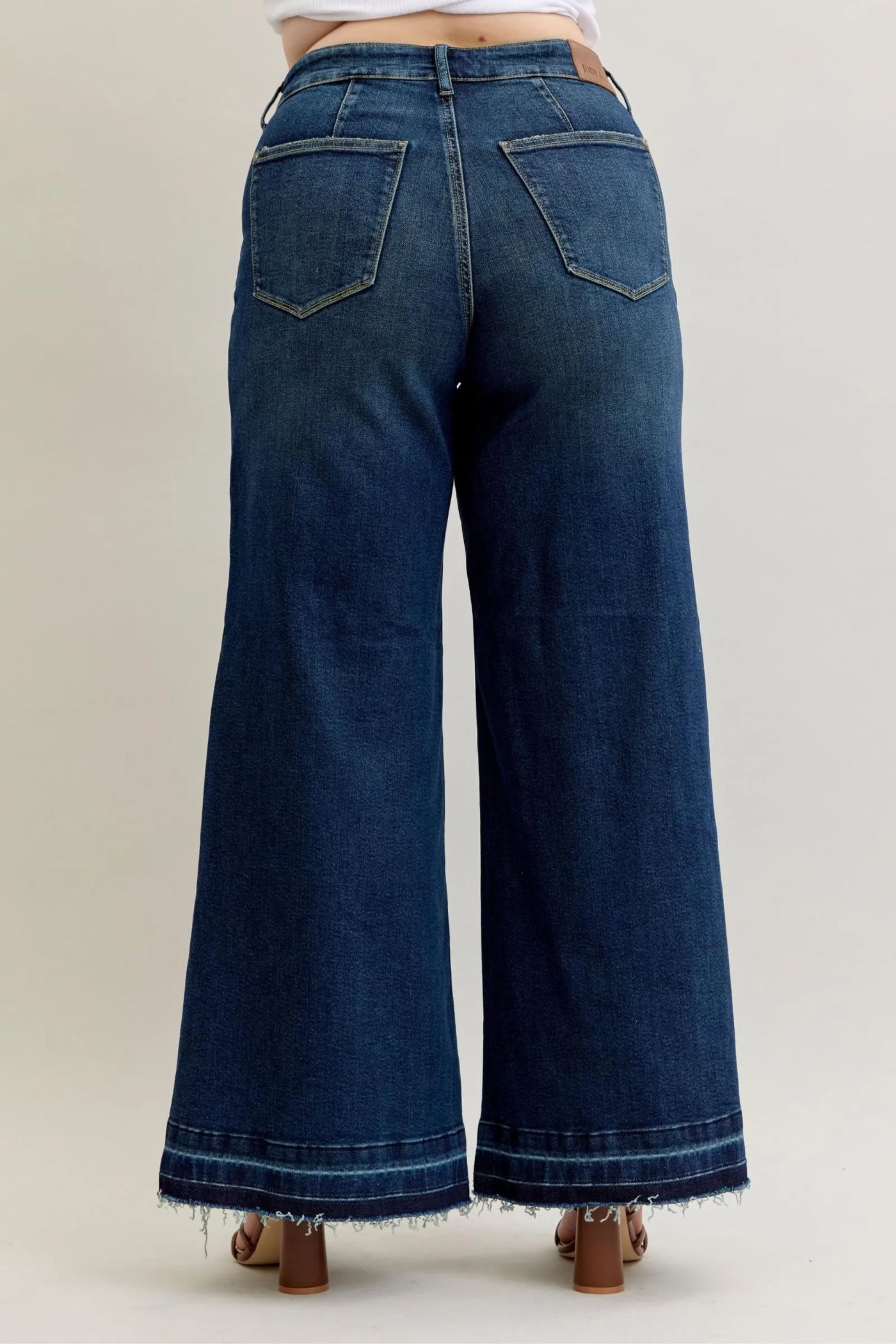 Back view of Judy Blue Jeans 881046 high waist wide-leg palazzo jeans in dark blue denim with frayed hem and patch pockets