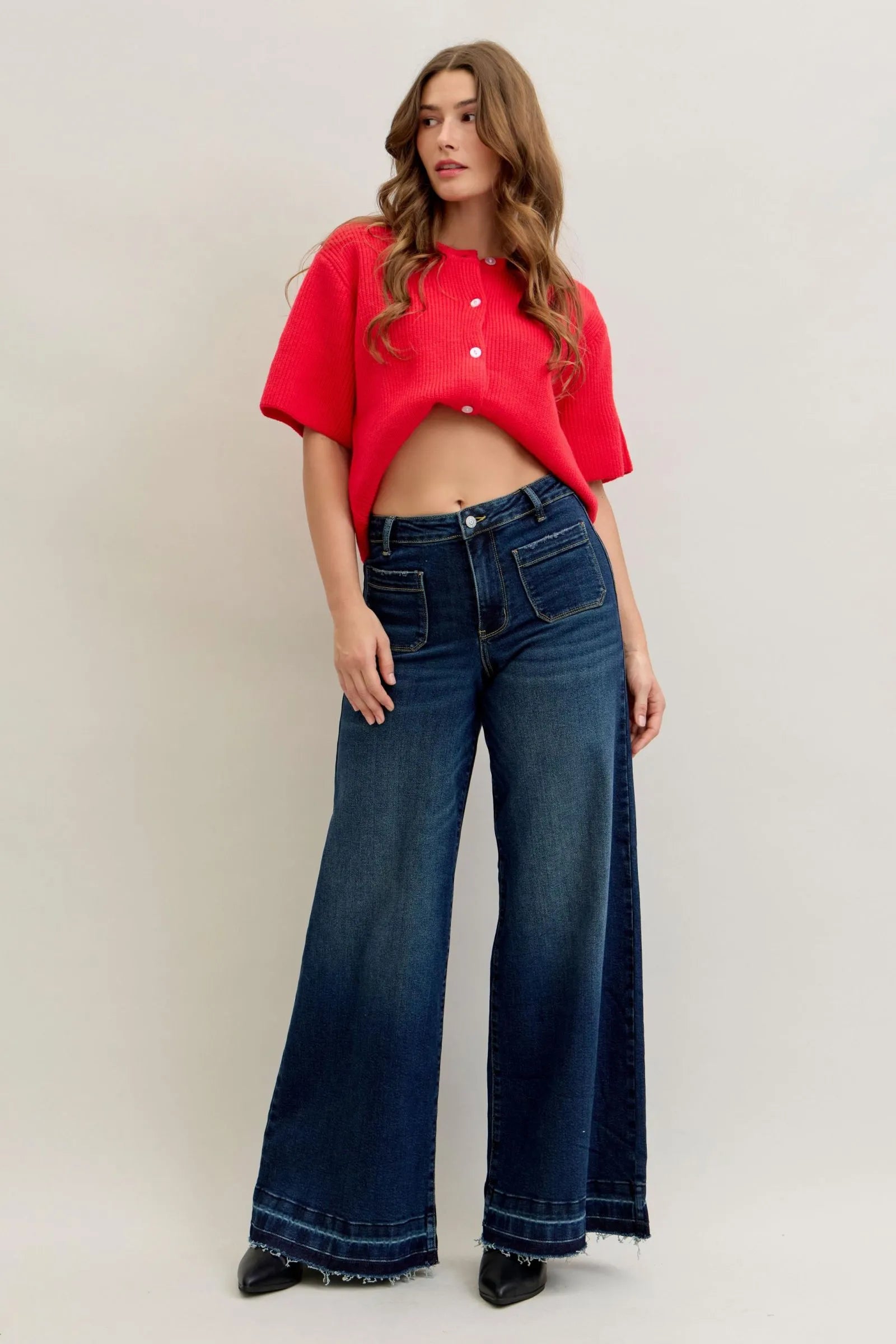 Woman wearing Judy Blue Jeans high waist palazzo wide-leg denim with a red top.