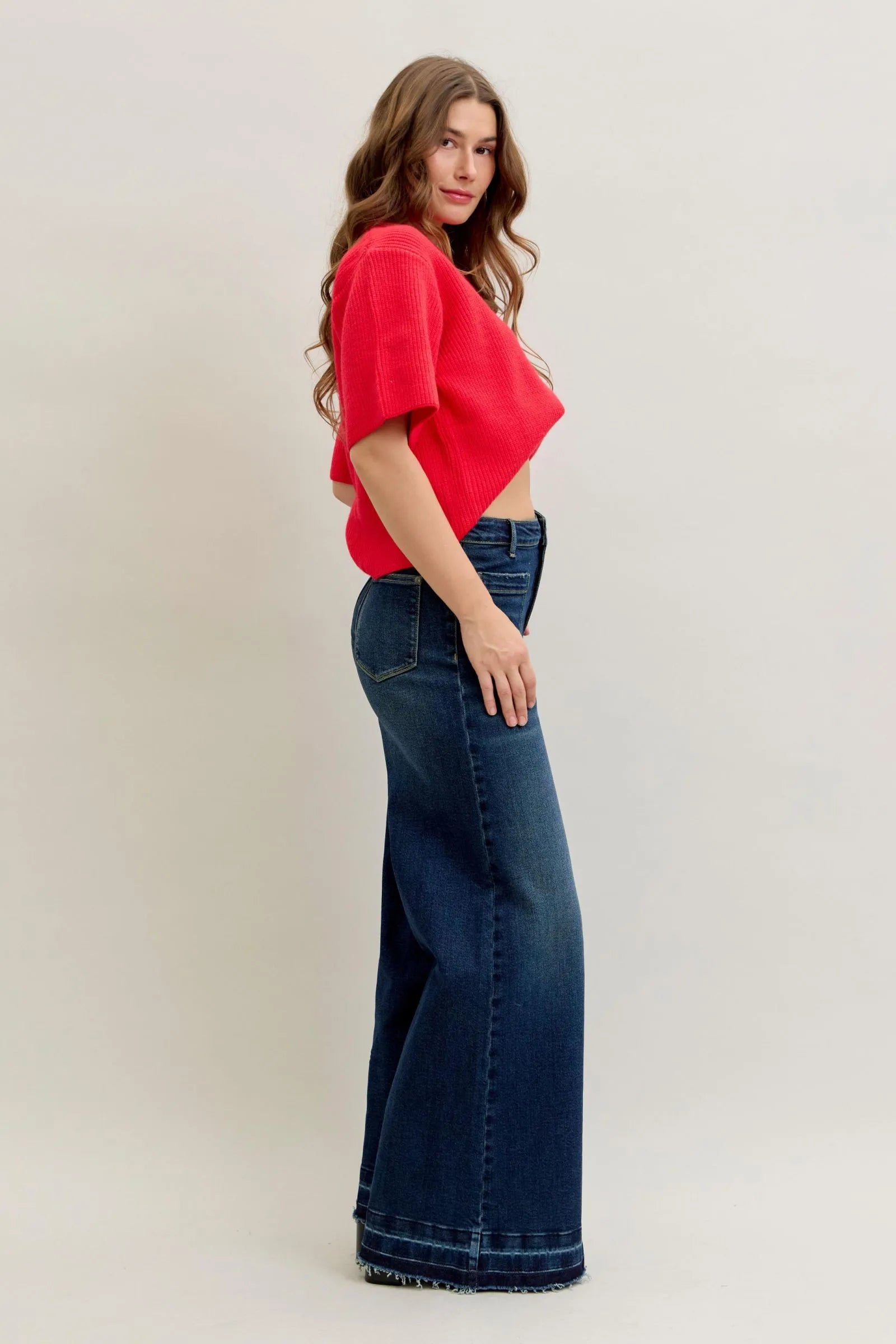 Woman wearing Judy Blue Jeans high waist palazzo wide-leg denim with a red top.