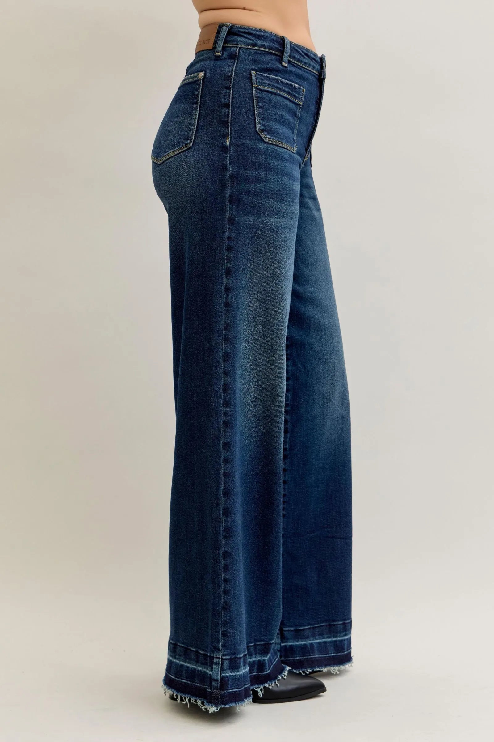 Side view of Judy Blue Jeans 881046 high waist palazzo wide-leg denim with front patch pockets and frayed hem