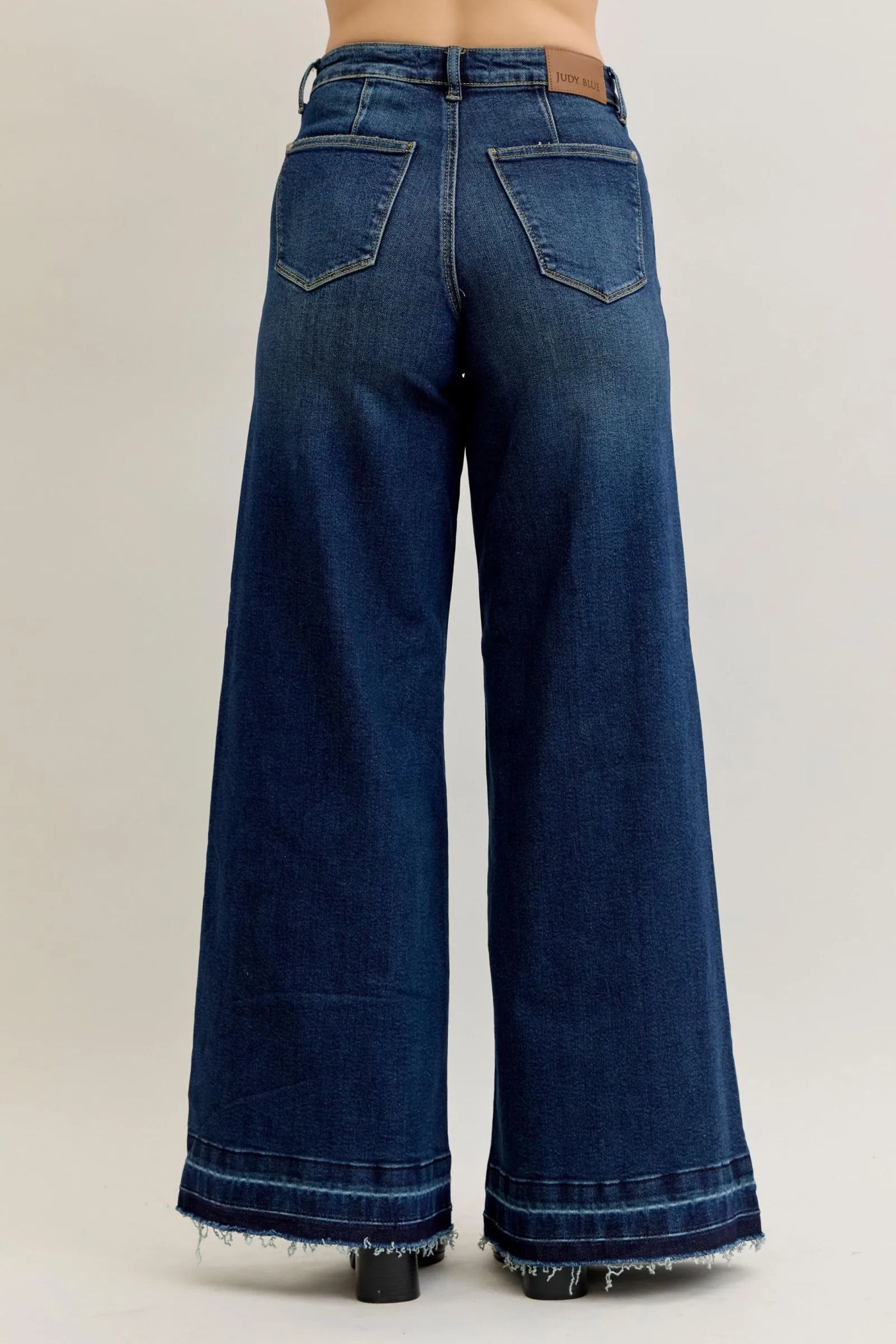 Back view of Judy Blue Jeans 881046 high waist palazzo wide-leg denim with patch pockets and raw hem in dark blue color
