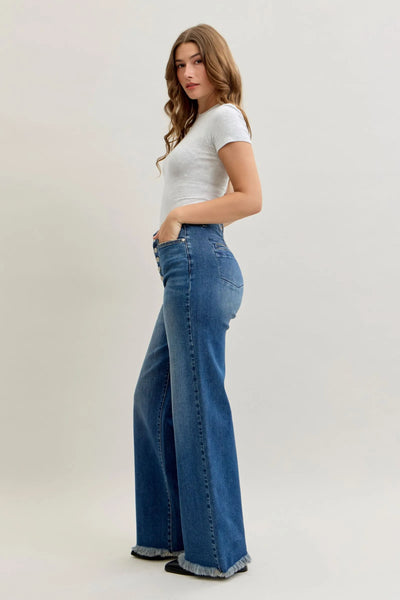 woman wearing Judy Blue Jeans high waist column straight blue denim jeans with button-fly and back welt pockets