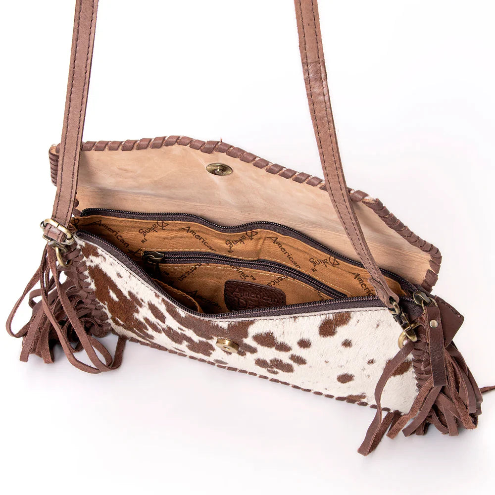 American Darling small crossbody messenger bag with cowhide leather, fringes, and adjustable strap.