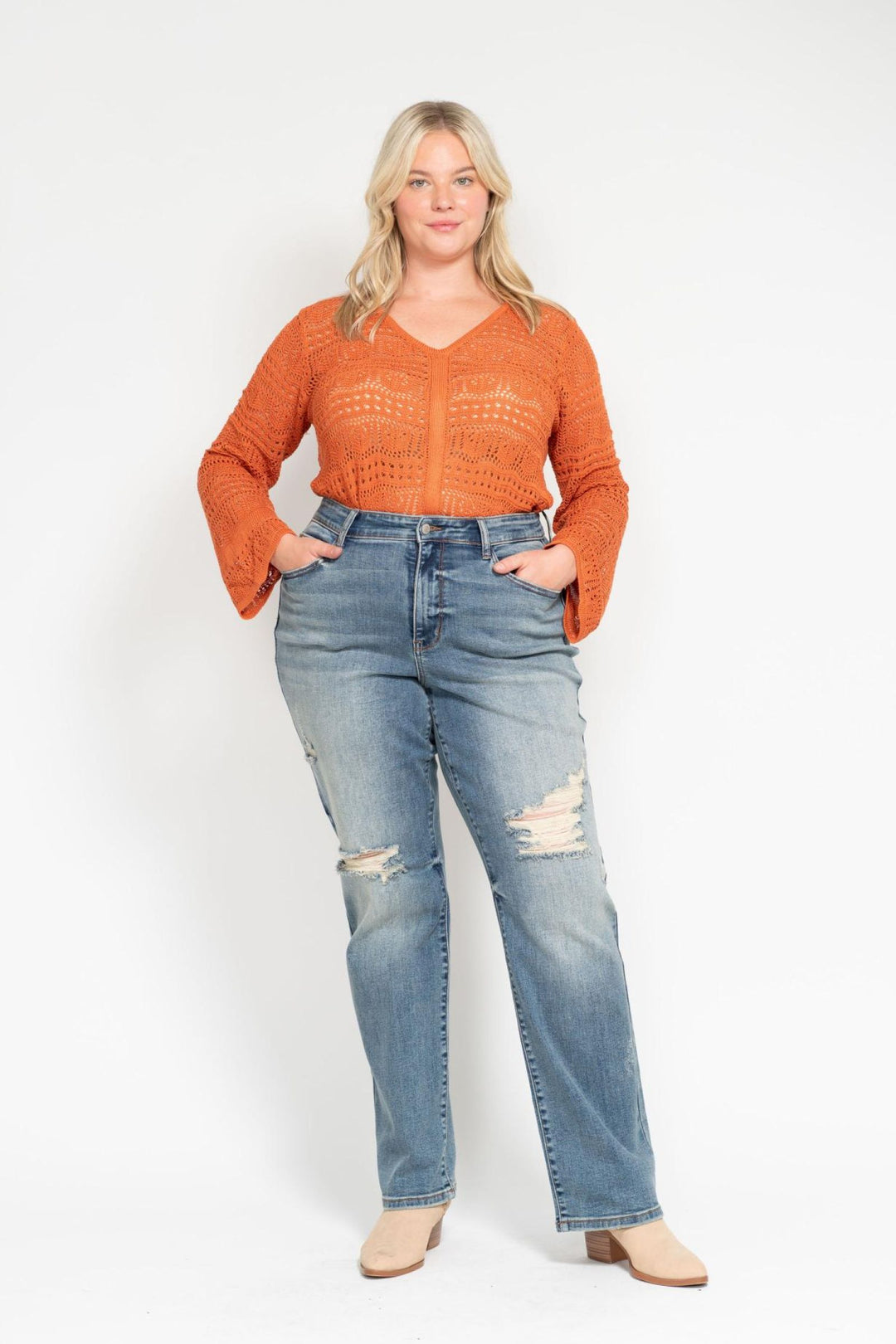 Woman wearing high waist dad straight Judy Blue Jeans 82641 with harsh tint and distressed details