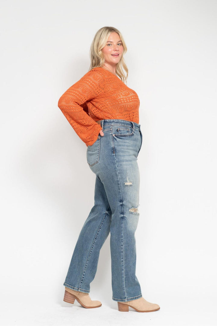 Woman wearing high waist dad straight Judy Blue Jeans 82641 with harsh tint and distressed details