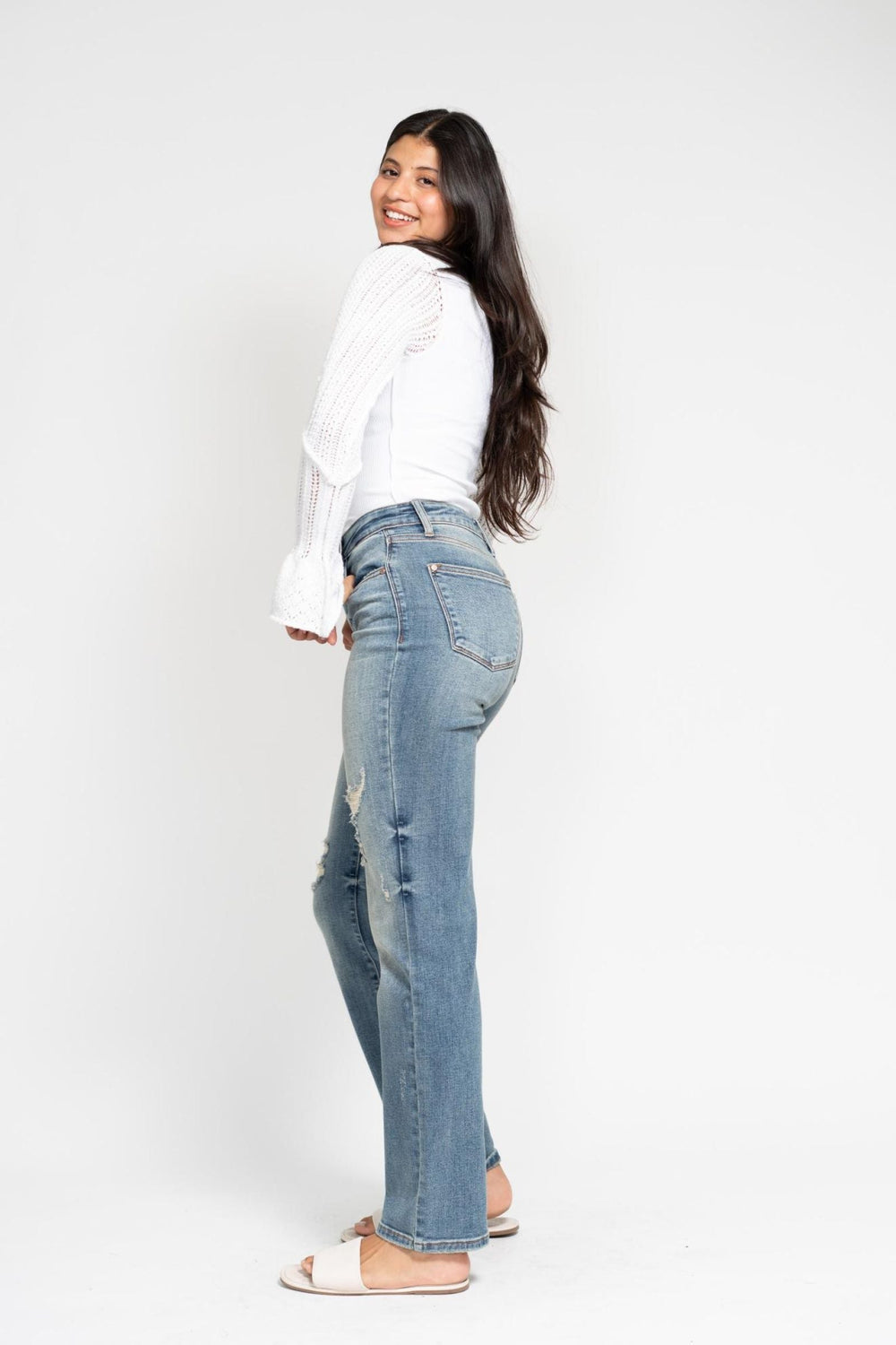 Woman wearing high waist dad straight Judy Blue Jeans 82641 with harsh tint and destroyed details