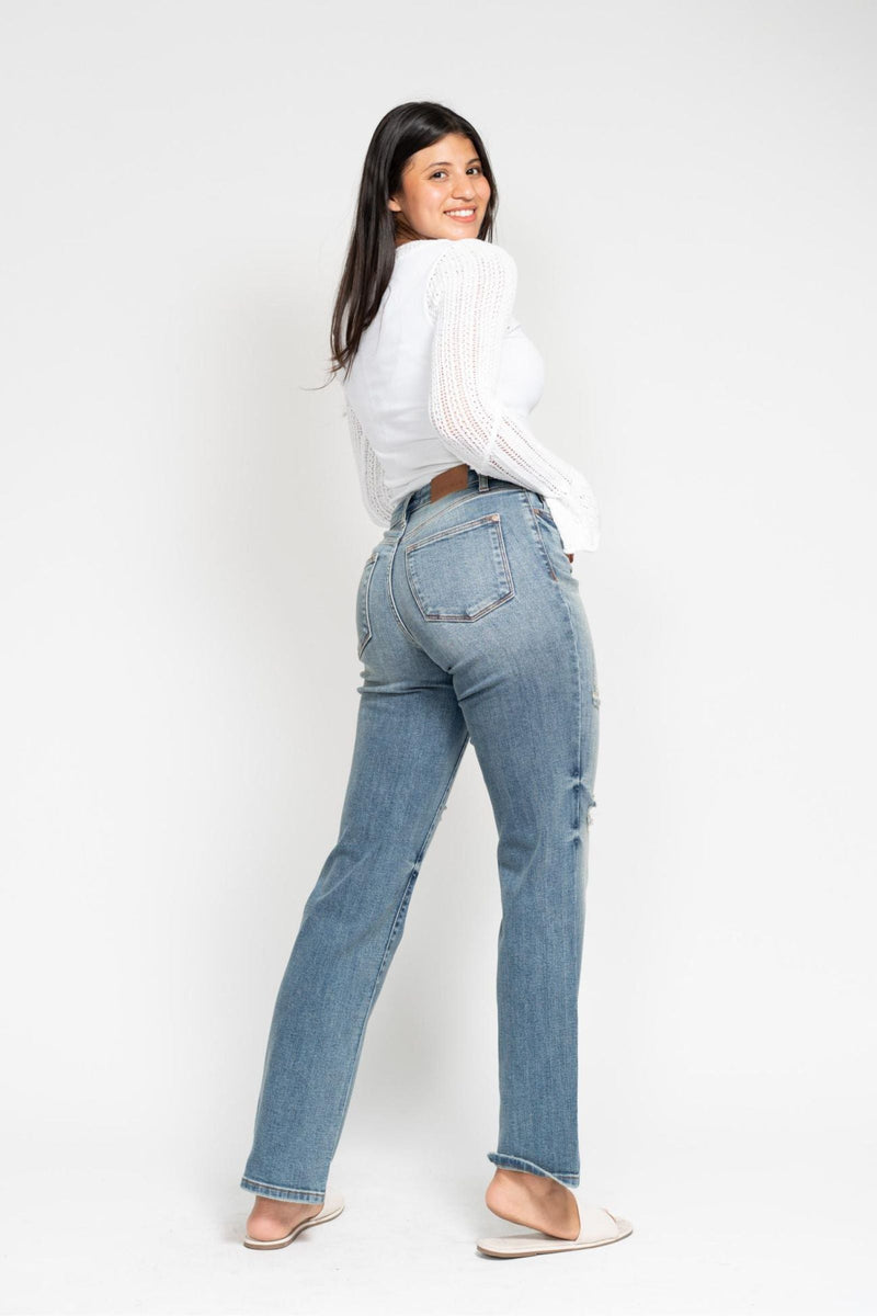 Woman wearing high waist dad straight Judy Blue Jeans 82641 with harsh tint and destroyed details