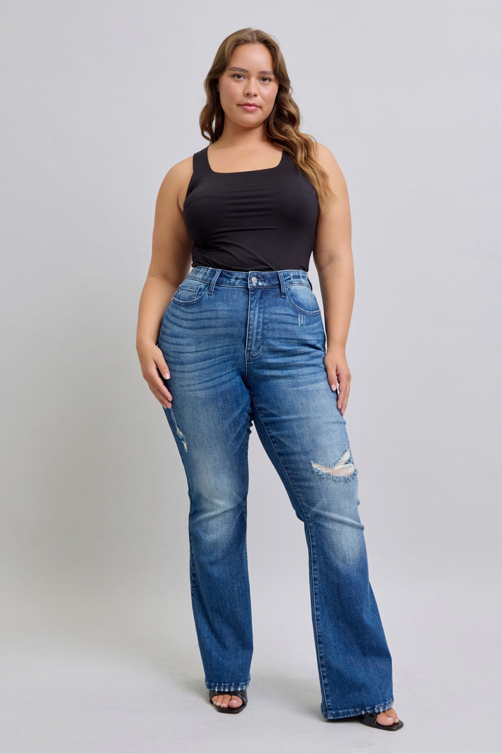 Plus size woman wearing high waist contrast wash destroyed flare Judy Blue Jeans 88383 with black tank top
