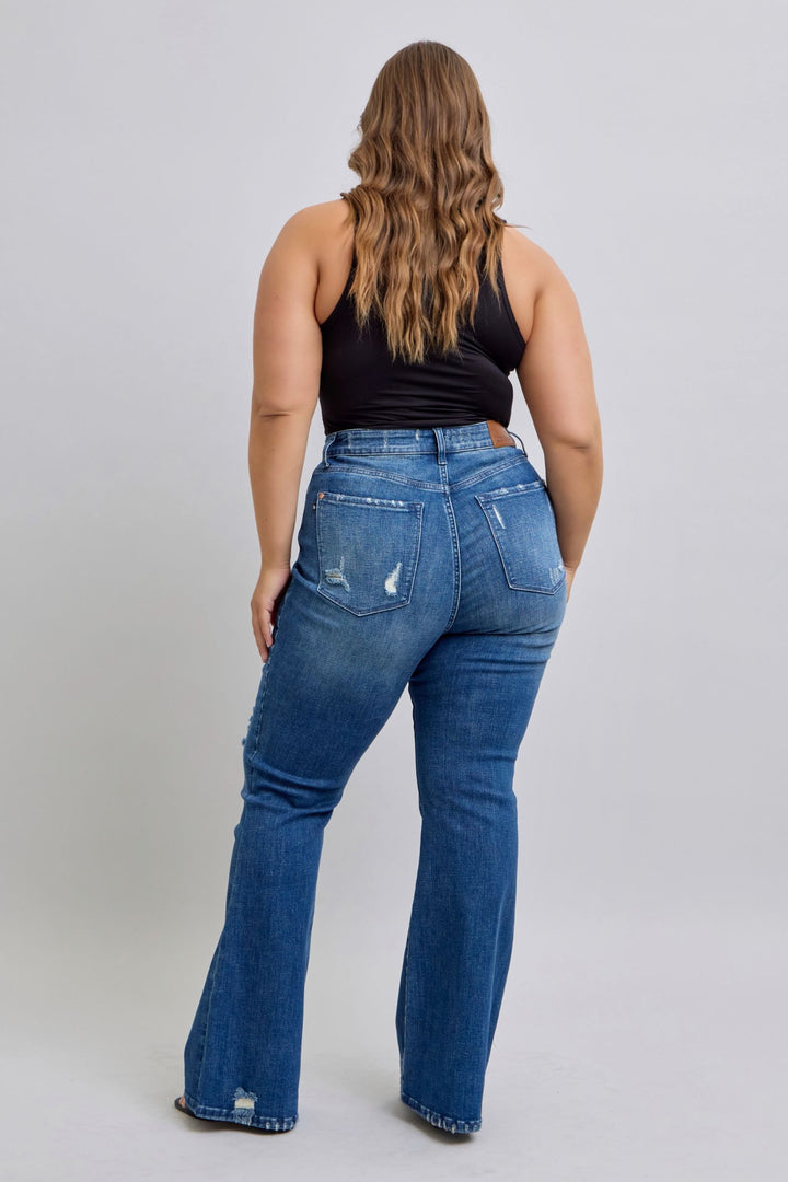 Back view of a woman wearing high waist contrast wash destroyed flare Judy Blue Jeans 88383