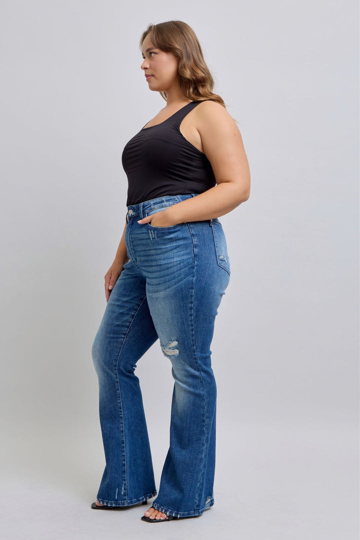 Plus size model wearing high waist contrast wash destroyed flare Judy Blue Jeans 88383 denim with black tank top