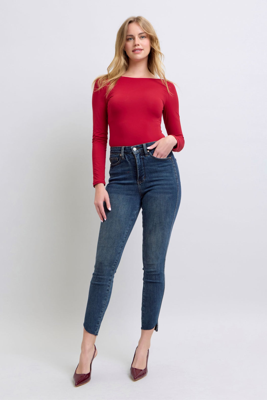 Woman wearing high waist Judy Blue Jeans 88913 with tummy control and step hem skinny fit