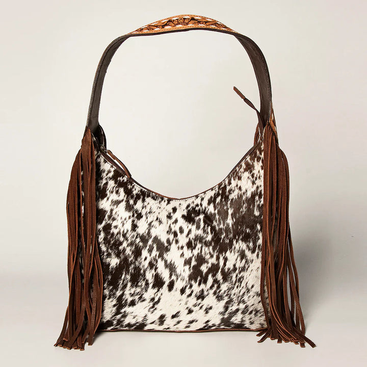 American Darling Handbag ADBGI112B with cowhide pattern and brown fringe detailing.