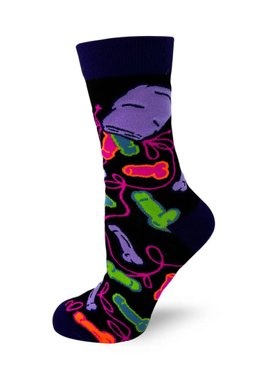 Sassy women's crew sock with colorful phallic designs and bold "Eat A Bag Of D***s" phrase, cotton blend.