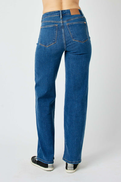 Back view of high waisted vintage wide leg Judy Blue Jeans in blue denim with pockets and stitching details