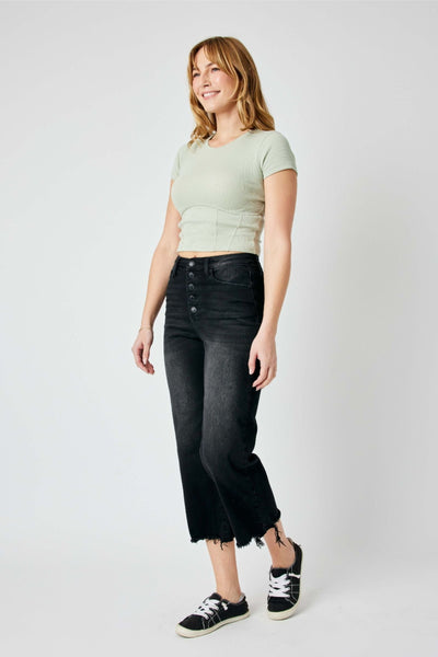 High-rise fit cropped wide leg jeans with distressed design and raw hem detailing.