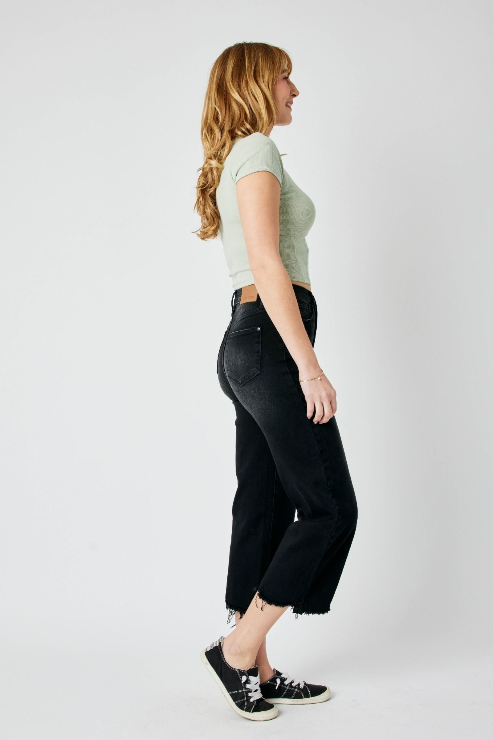 High-rise fit Judy Blue Jeans 88829 with distressed design and raw hem detailing.