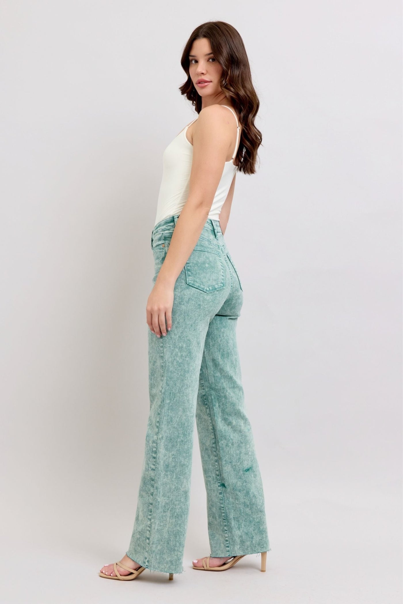 High waist garment dyed dad jeans in sea green with raw hem.
