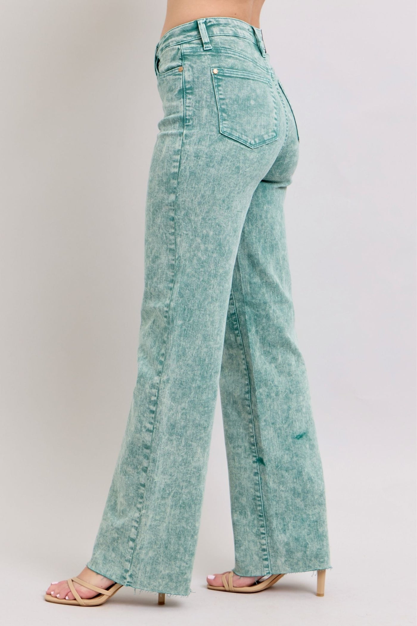 High waist garment dyed dad jeans in sea green with a raw hem for a relaxed fit.