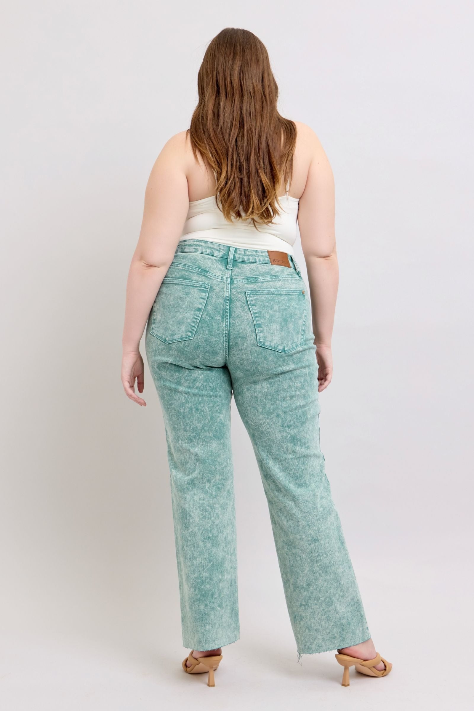 High waist garment dyed sea green jeans with raw hem.