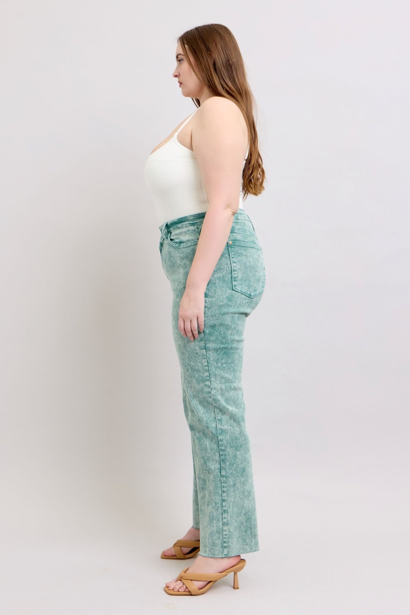 High waist sea green garment dyed jeans with a relaxed straight leg and raw hem.