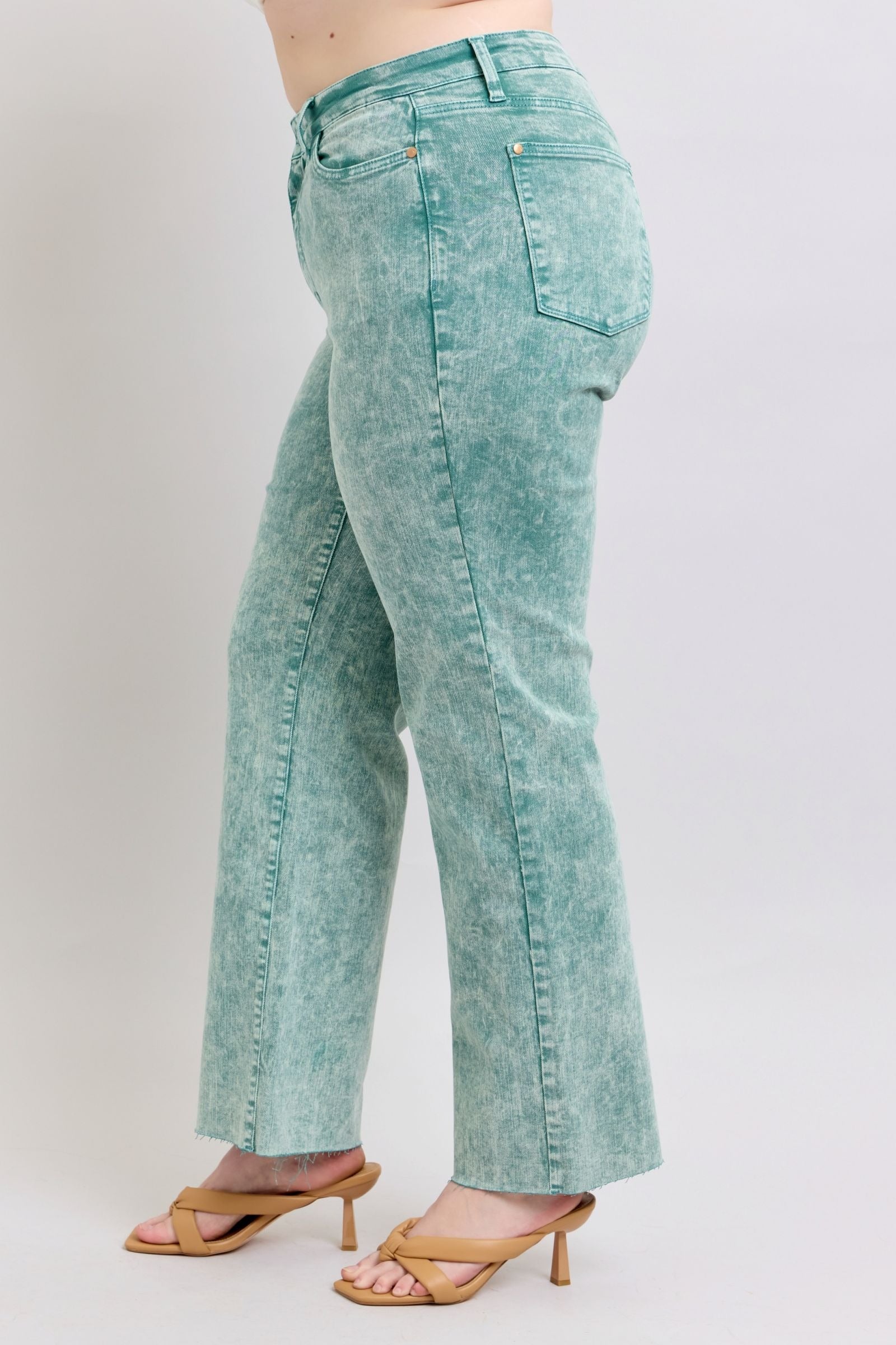 High waist sea green garment dyed jeans with a relaxed straight leg and raw hem finish.