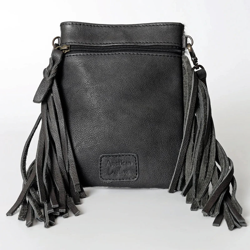 Black American Darling crossbody messenger bag with genuine full grain leather, western style fringes, adjustable leather strap, and antique finish metal fittings.