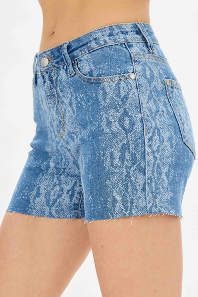 Mid-rise Judy Blue Shorts with snake print and raw hem.