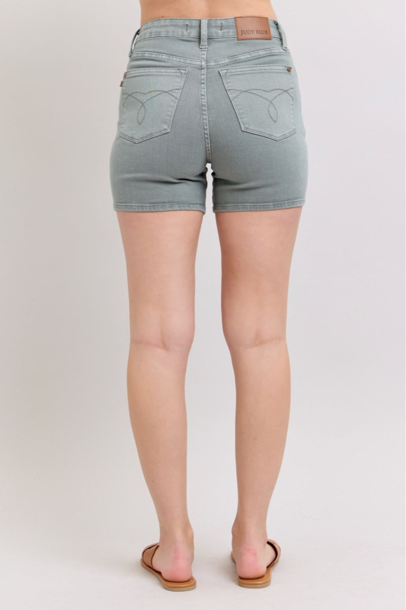 Judy Blue high waist garment dyed pocket embroidery shorts in blue on model