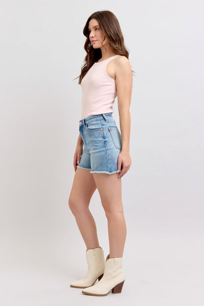 High-rise Judy Blue Shorts with embroidery and raw hem.