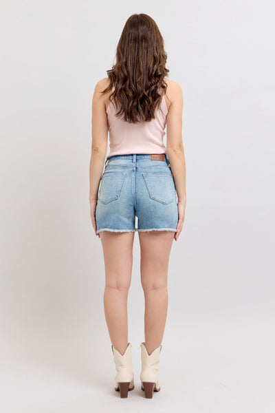 High-rise Judy Blue Shorts with western embroidery and raw cut-off hem.